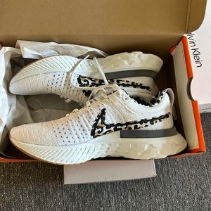 White Nike React Infinity with leopards